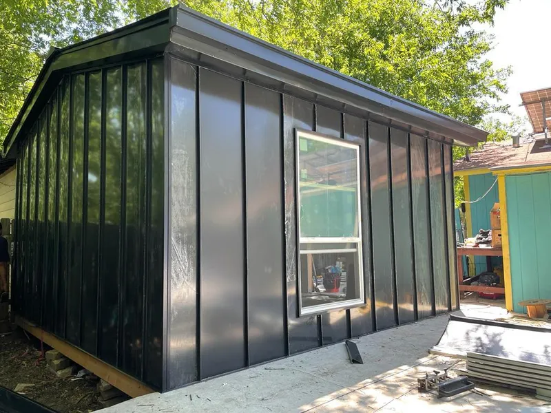 Black standing seam metal wall panels for Roof Inspection in Newington Forest